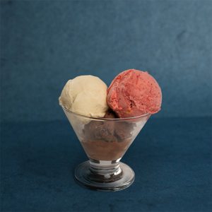 A delightful trio of creamy ice cream scoops layered in a glass, offering a smooth, rich texture and a perfectly balanced, indulgent treat.